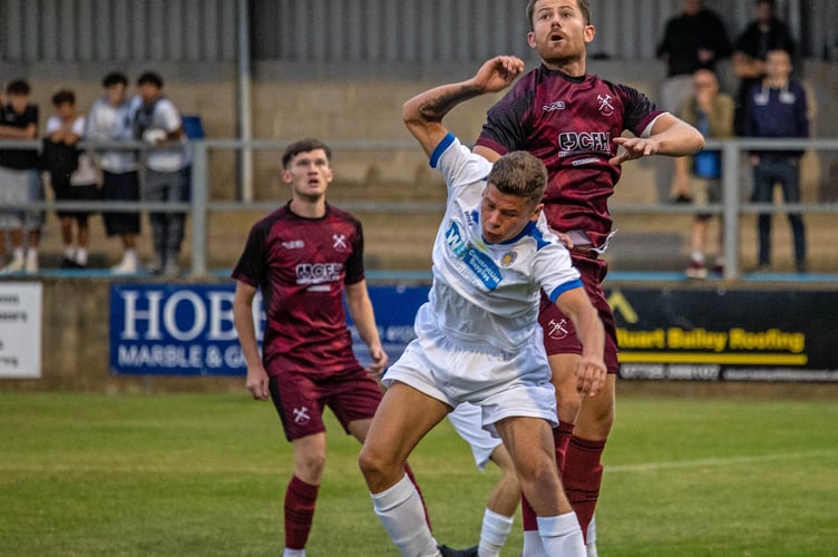 Action from Paulton Rovers' home win over Oldland Abbotonians