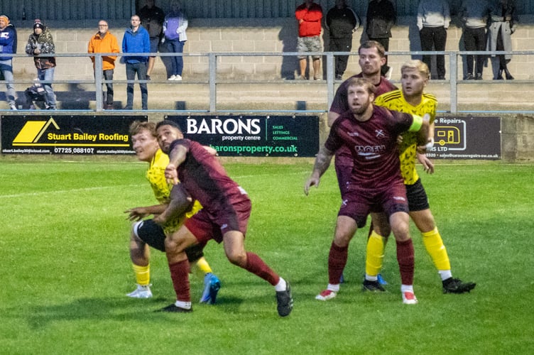 Action from Paulton Rovers' home game against top of the table Clevedon Town