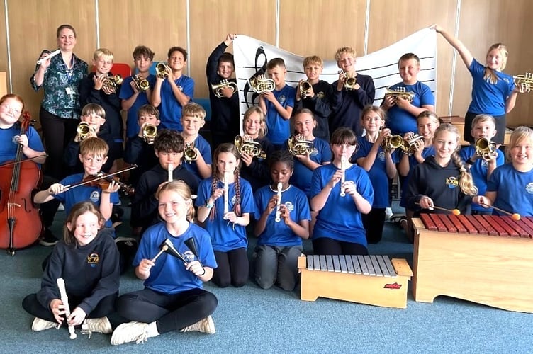 Peasedown St John Primary School Year 6 pupils with the new musical instruments.