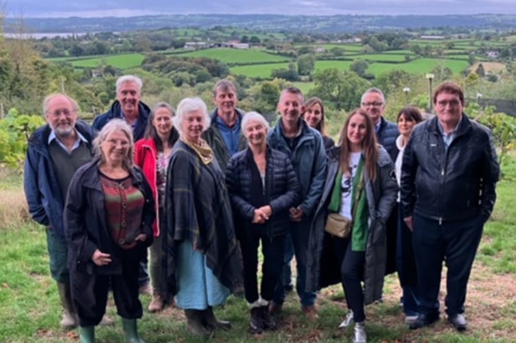 Chamber members in the vineyard against a picturesque backdrop