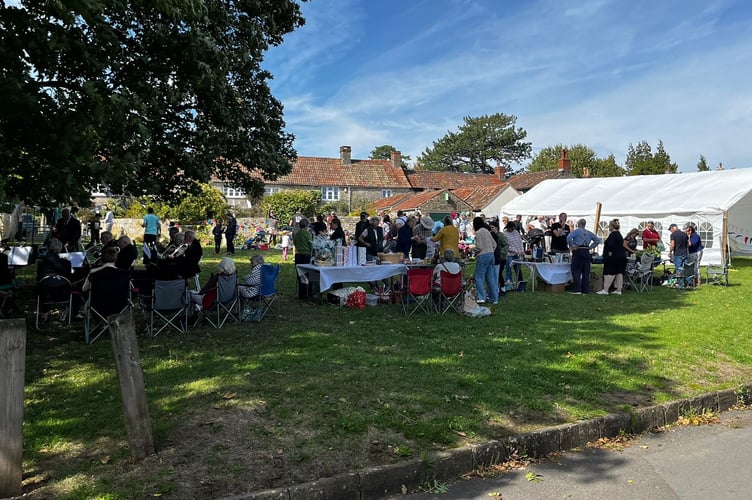 The many visitors enjoying the late summer sunshine crowded the green which looked resplendent after the weeks of be a parched and brown parched patch.