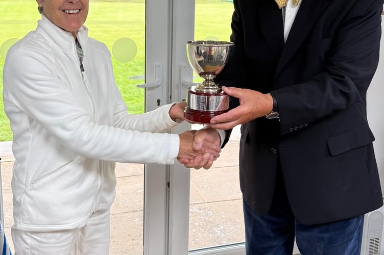  Brian Wilson, representing Croquet England and Camerton and Peasedown CC, presenting the silver cup to tournament winner Fiona Walker.