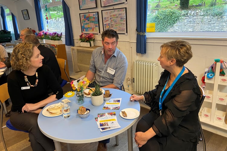 Anna, MP and Bev, Chief Executive of SWALLOW, chatting at the event with a business representative.