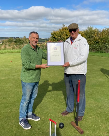 Brian Wilson, right, receives his Croquet England Diploma from CPCC member Andy Loakes.
