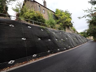 Partially collapsed embankment stabilised