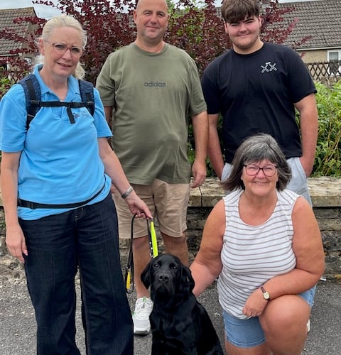 The family meets Luke, the guide dog puppy, for the first time as he begins his training in memory of their son.