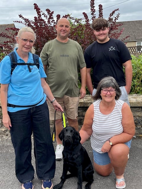 The family meets Luke, the guide dog puppy, for the first time as he begins his training in memory of their son.