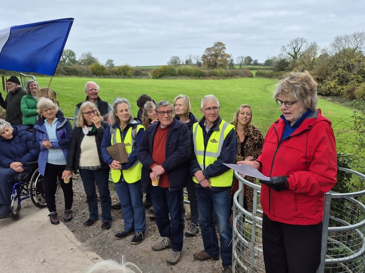 Cllr Ros Wyke speaks at the opening of the new Hamwood Viaduct to Thrupe Lane route, created in partnership with local landowners, before cutting the ribbon alongside the gathered crowd.