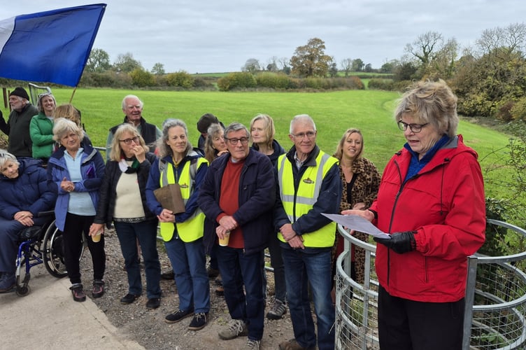 Cllr Ros Wyke speaks at the opening of the new Hamwood Viaduct to Thrupe Lane route, created in partnership with local landowners, before cutting the ribbon alongside the gathered crowd.