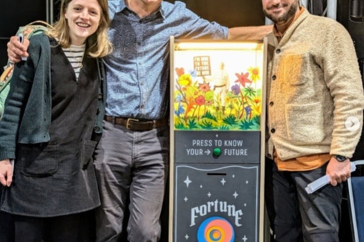 Rob Hopkins and Matt Mellen with the fortune telling machine