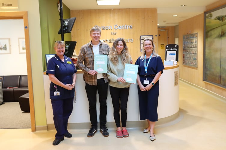Pictured are mum Faye, dad Ryan and twins Conall and Murray. Also seen are Lead Nurse Kirstie Flood and Cindy Aze, County Registrar.