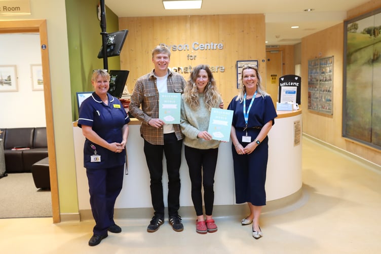 Pictured are mum Faye, dad Ryan and twins Conall and Murray. Also seen are Lead Nurse Kirstie Flood and Cindy Aze, County Registrar.