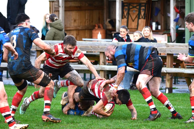 Midsomer Norton (blue hoops) in action against Frome