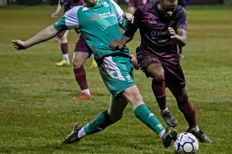 Action from Welton Rovers' cup-tie at home to Paulton Rovers