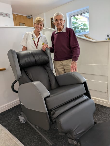 Terry Fisher donating the tilt-and-space chair to the hospital