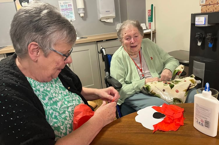 Jean and Valarie making poppies for Remebrance at the Kingfisher Lodge Care centre in Saltford