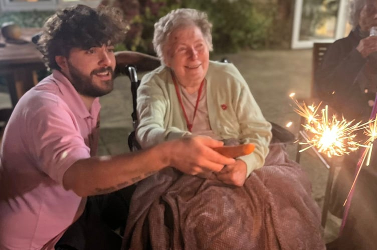 Jean and George (staff) with a sparkler