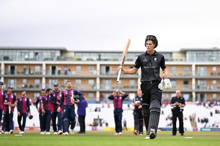 Archie Vaughan acknowledges the applause after scoring his maiden century for Somerset against Northants