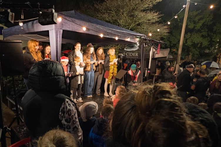 Festive cheer filled Midsomer Norton as the community gathered for the Christmas Lights Switch-On, defying rainy weather with joy and entertainment.