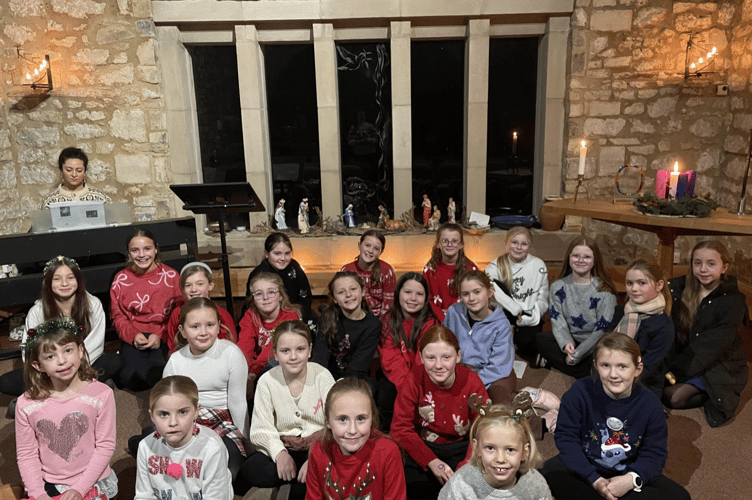 Residents and families gathered at the Ammerdown Centre for the annual Community Carols by Candlelight, where St John’s Choir led a selection of traditional carols.