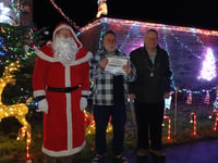 Thirty-five year old snowman helps win best Christmas lights