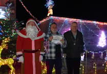 Thirty-five year old snowman helps clinch the title of best Christmas lights