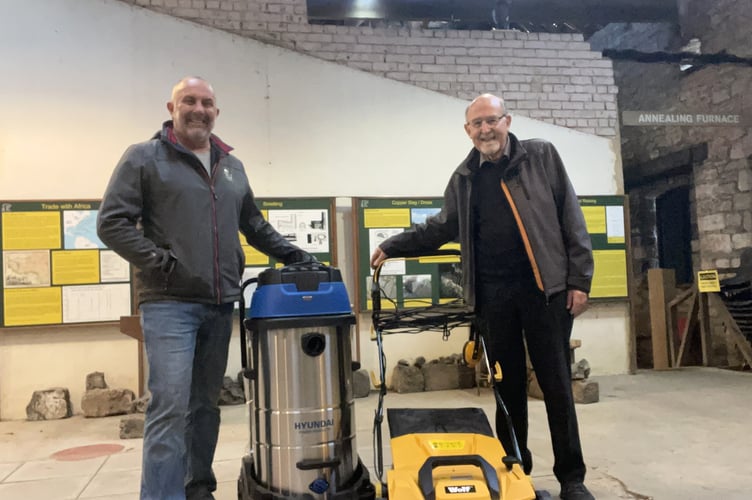 At the Saltford Brass Mill, Cllr Chris Warren (left) is stood next to a water vacuum along with Saltford Brass Mill chairman Stavros Christofides (right) who is next to a floor scrubber