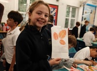 Candles light up the night sky to mark future woodland