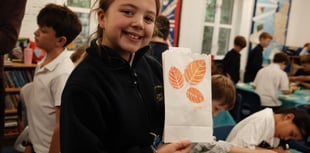 Candles light up the night sky to mark future woodland