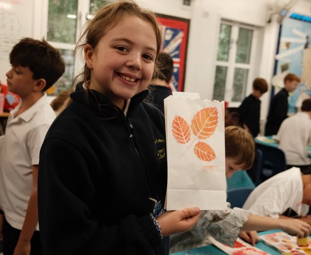 Candles light up the night sky to mark future woodland