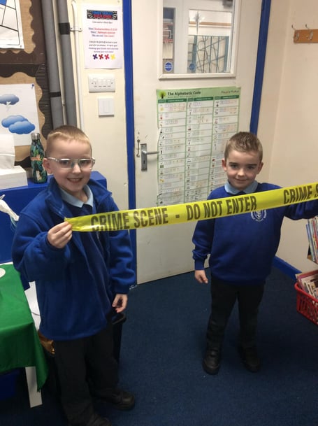 Pupils getting hands on with some of the equipment used by the local police team