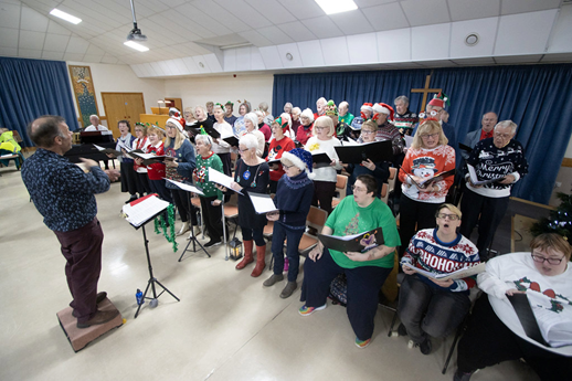 The Good Afternoon Choir at North Somerset performing at its annual Christmas Celebration Carol Concert supporting the work of Nailsea Tithe Barn Trust / Memories at the Barn