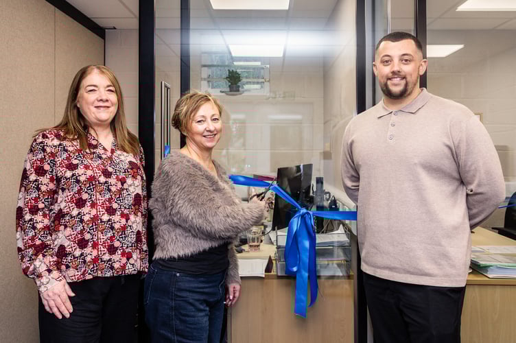 Photo Caption: Beverley Craney, SWALLOW Chief Executive cutting the ribbon on the new offices with Karen Williams and George Fray from Optima