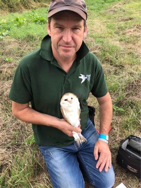 Chris Sperring with a barn owl