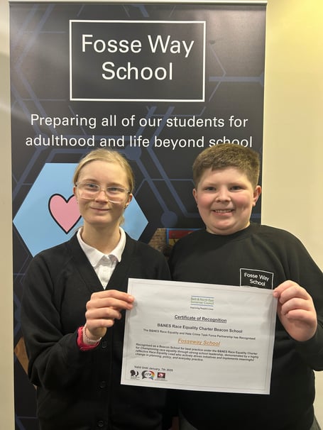 Pupils from Fosse Way School with the Beacon School certificate for their race equality work.