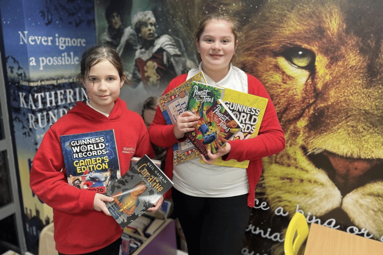 Westfield Primary pupils Niamh and Paige raised funds for new books by selling cakes at school.