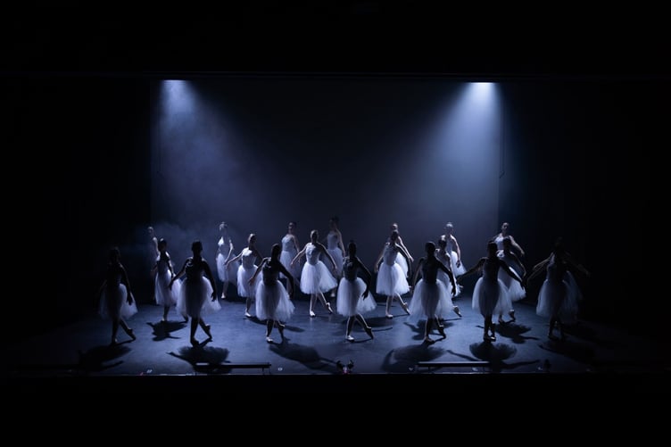 A scene from Swan Lake at the 2026 Sue Hill Dance show featuring IDTA awarded dancers Jazzy, Maddie and Jasmine.