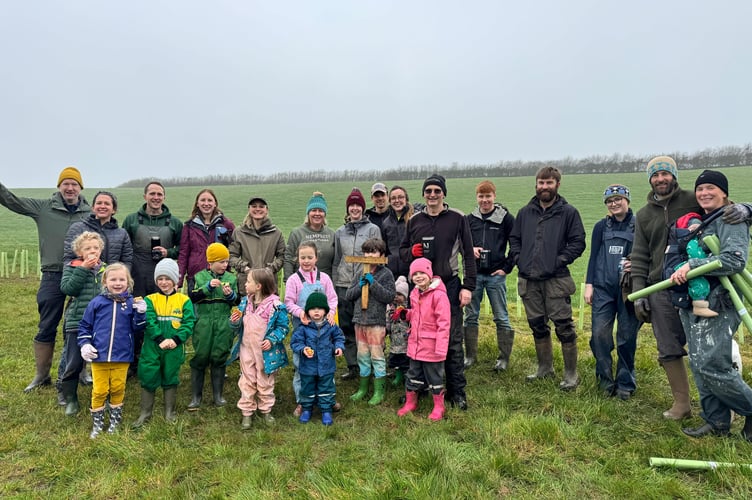 Families from Ubley Primary School at Nempnett Pastures helping plant trees