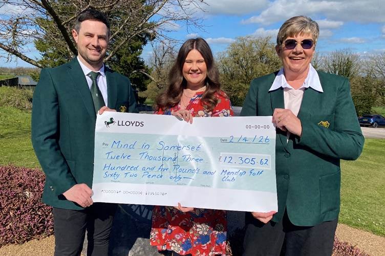 Jack Hayes, Louise Scott and Victoria from Mind in Somerset, being presented with the cheque.