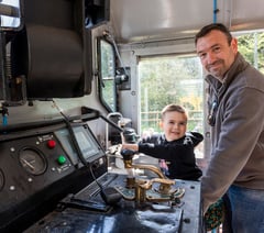Radstock schoolboy's names new electric locomotive at Whatley Quarry