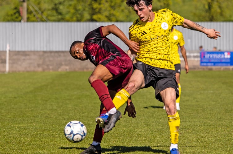 Action from Paulton's home game against Clevedon Town