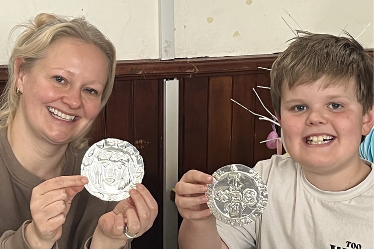 Hand-made Norman coins at the free coin-making workshop for the production at the Chew Valley Library in Bishop Sutton