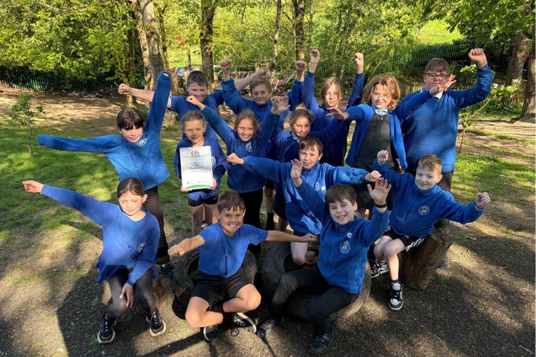 Pupils from High Littleton Primary celebrating their third consecutive Opal award for transformed play times.