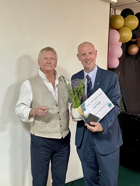 John Dando being honoured for a lifetime of service to Midsomer Norton by Cllr Gordon Mackay. 