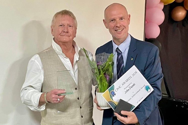 John Dando being honoured for a lifetime of service to Midsomer Norton by Cllr Gordon Mackay.
