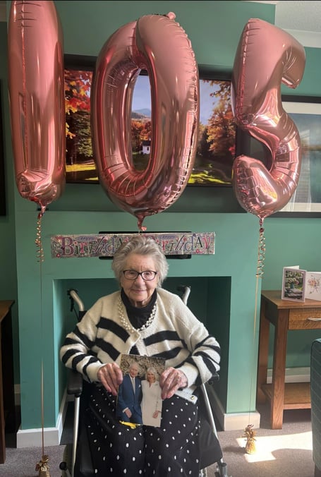 Enid Snook celebrating her 105th Birthday with   congratulations from the King and Queen. 