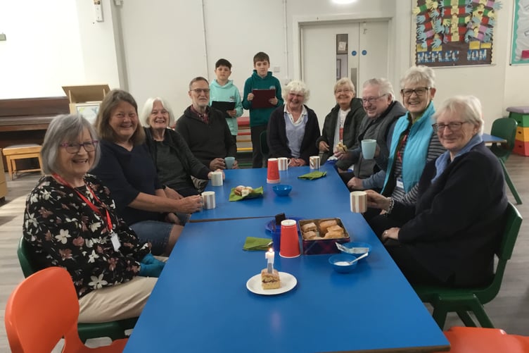 Pupils serving up tea and cake in their popular Cameley Café as they celebrate its first anniversary.