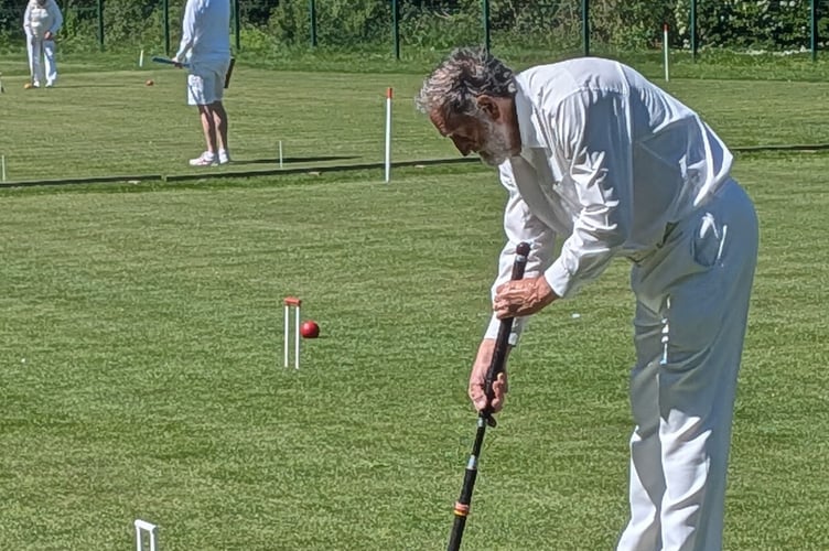 Phil Hendy runs an easy hoop with his black ball during the Morton-in-the-Marsh Level 5+ match