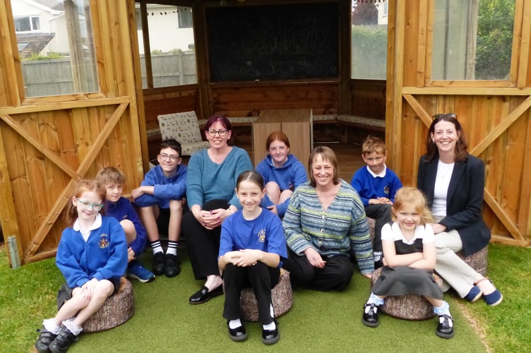 Celebrating their rcent Ofsted scorecard results are (from left to right) Annie Ford of SENDCO, deputy headteacher Nicola Bryant, headteacher Lorraine Woollven and pupils of the school