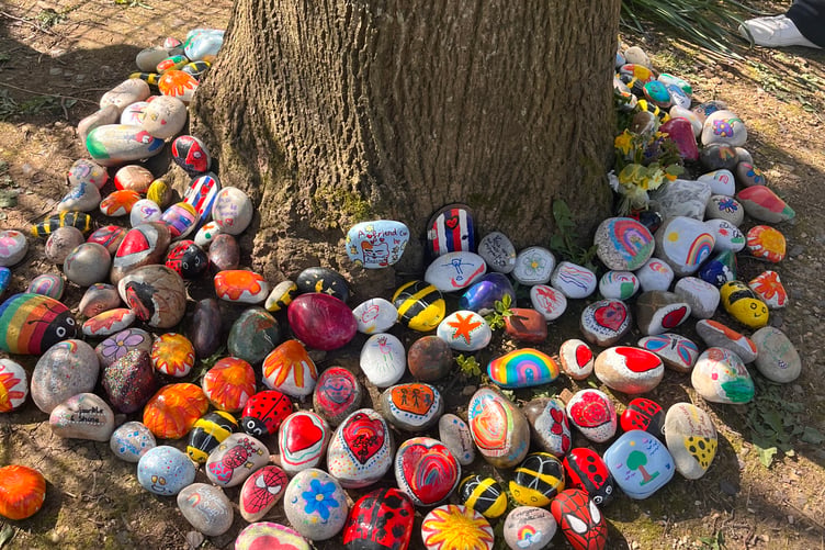 A memory tree is at the heart of the garden where children can leave messages and remember Elias.